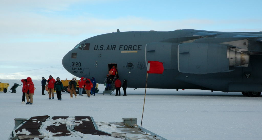  Scientists emerge on the sea ice from a C-17 Globemaster III after their flight from Christchurch, New Zealand to McMurdo Station. 