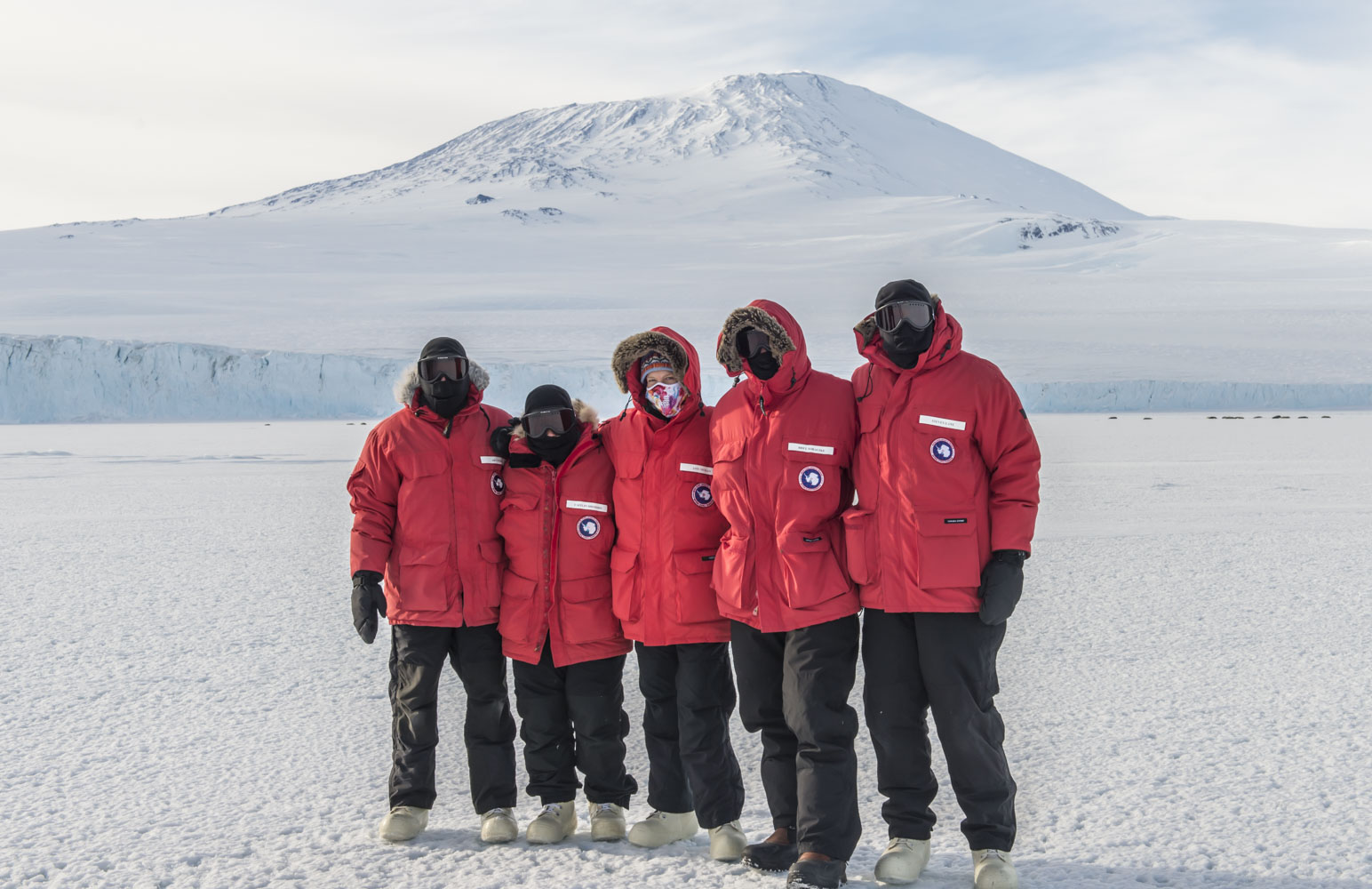  Our team in front of Mt. Erebus (an active volcano on Ross Island, where McMurdo Station is located) during sea ice training. 