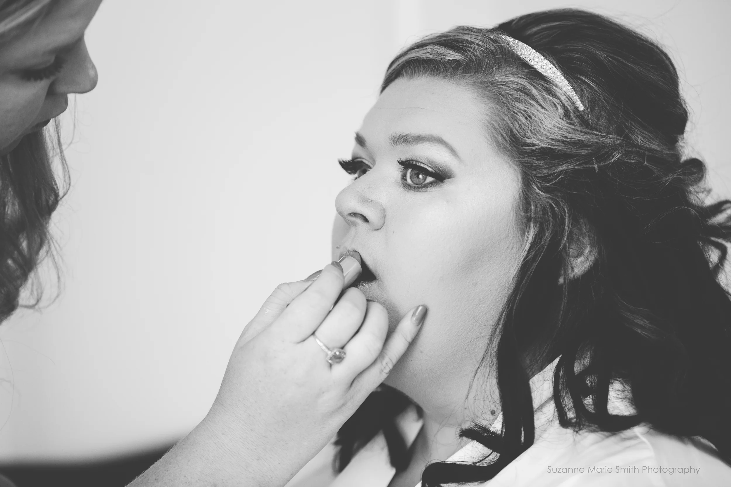 Derrick getting her makeup done