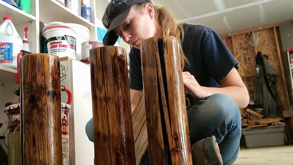   This is me adding a coat of stain to the table legs. These legs are actually salvaged fence posts that we found on the farm!  