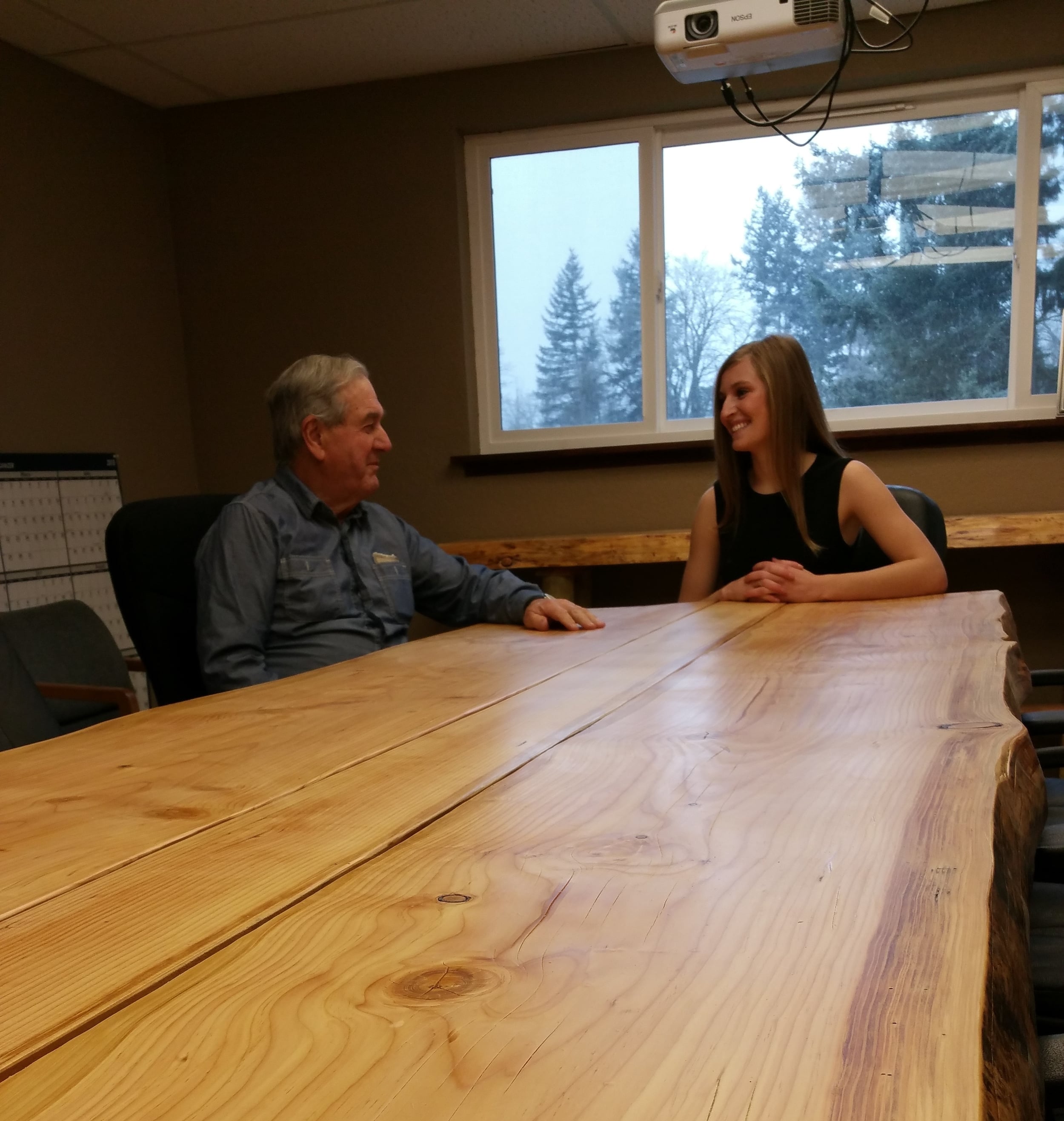  This is me (on my 21st birthday!) discussing business with my grandfather at the finished conference table. My grandfather is 79 but I am pretty sure he is Hercules. He helped my dad and I unload some flitches that were close to 300 pounds!&nbsp;As 