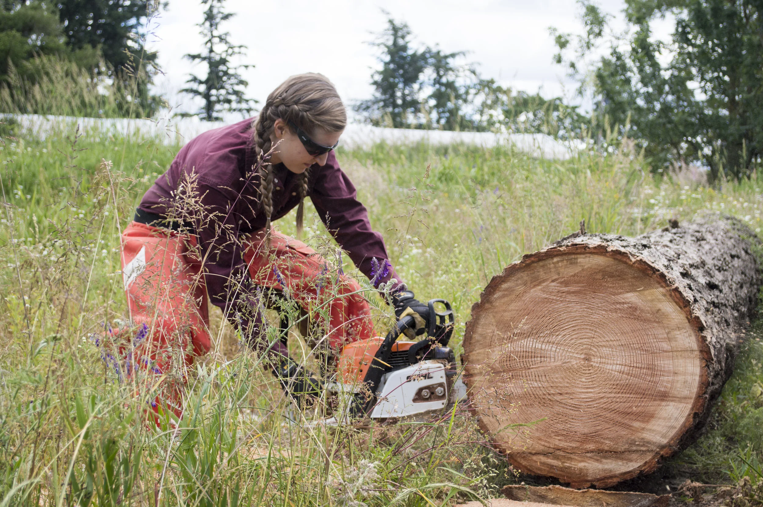 This is me, Katie Wilcox, and I am 24 years old. I took shop back in 7th grade at Yelm Middle School, but that was the extent of my woodworking experience before I started sawmilling with my dad. I don’t think 7th grade Katie would believe what I’m doing today!