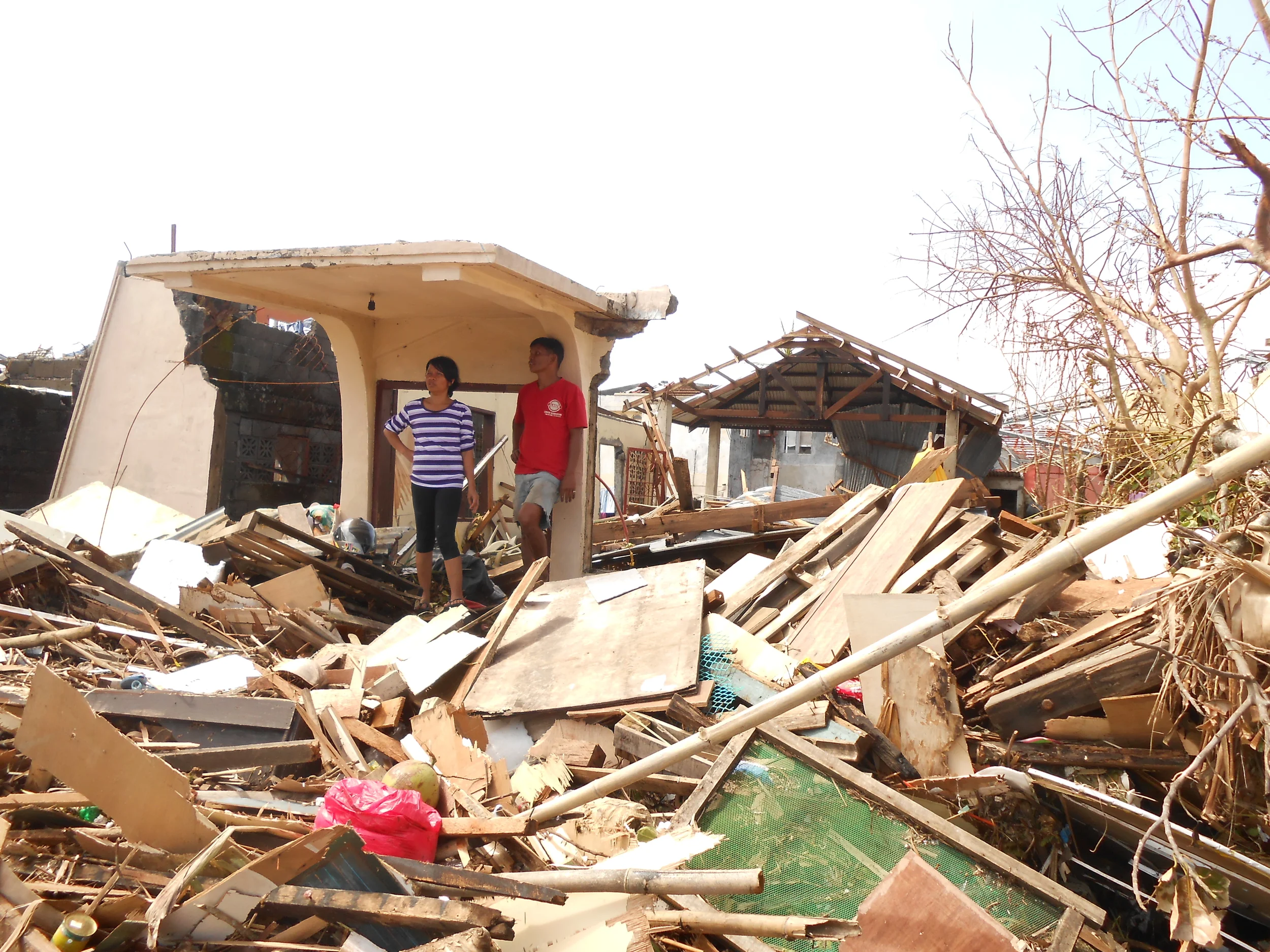 The aftermath of Haiyan: 31 Tanauan Church - 2 by SSD Office of Adventist Mission is licensed under CC BY 2.0.