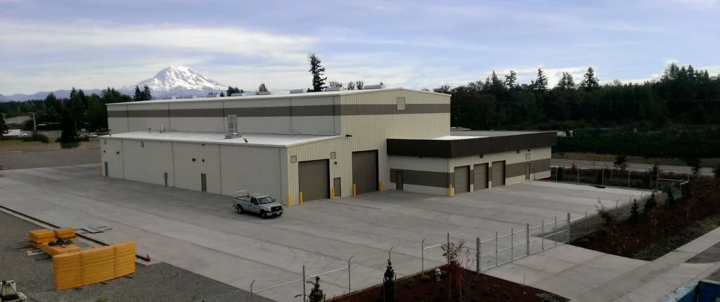 At 13,500 square feet, this maintenance shop houses a 25-ton bridge crane, an assembly line style parts washing and paint shop, large parts warehouse and administrative/sales offices. The storage yard contains a 130-foot tall tower crane which travels along guide rails allowing it to cover an area of 180,000 square feet.