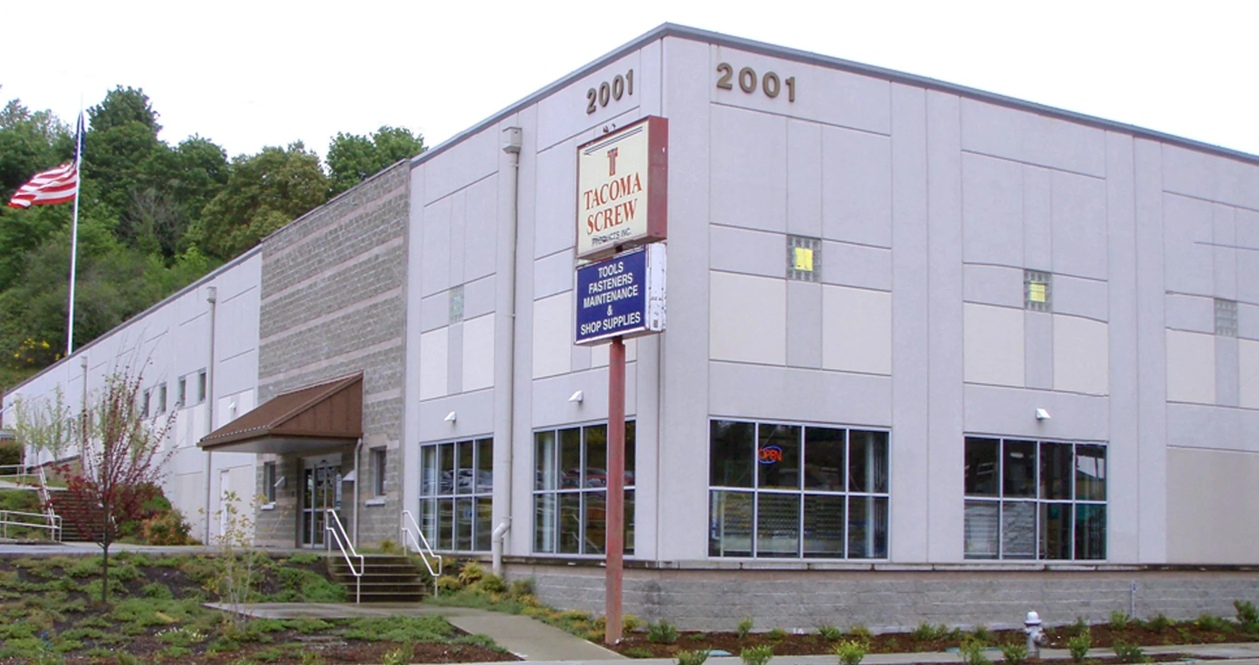 ART assisted Tacoma Screw Products to design and build a new Headquarters and Warehouse building on an existing parking lot. The existing site topography dictated a tier-parking layout on three distinct levels. The program required 50,000 square feet on one floor, with 5,000 square feet for retail space and 44,000 square feet of warehouse space. An approximately 13,000 square foot mezzanine is dedicated to office functions.