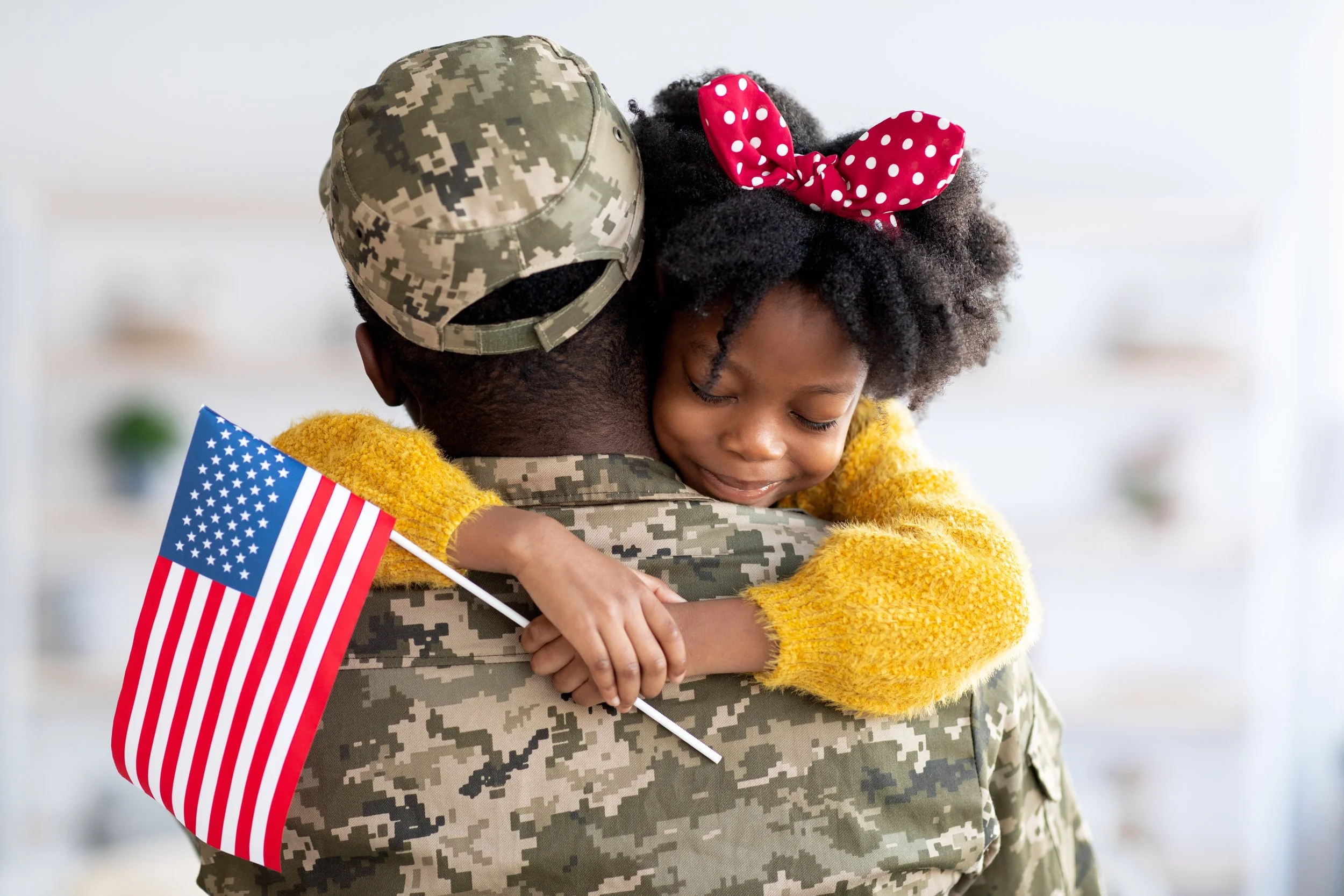 veteran hugging little girl.jpg