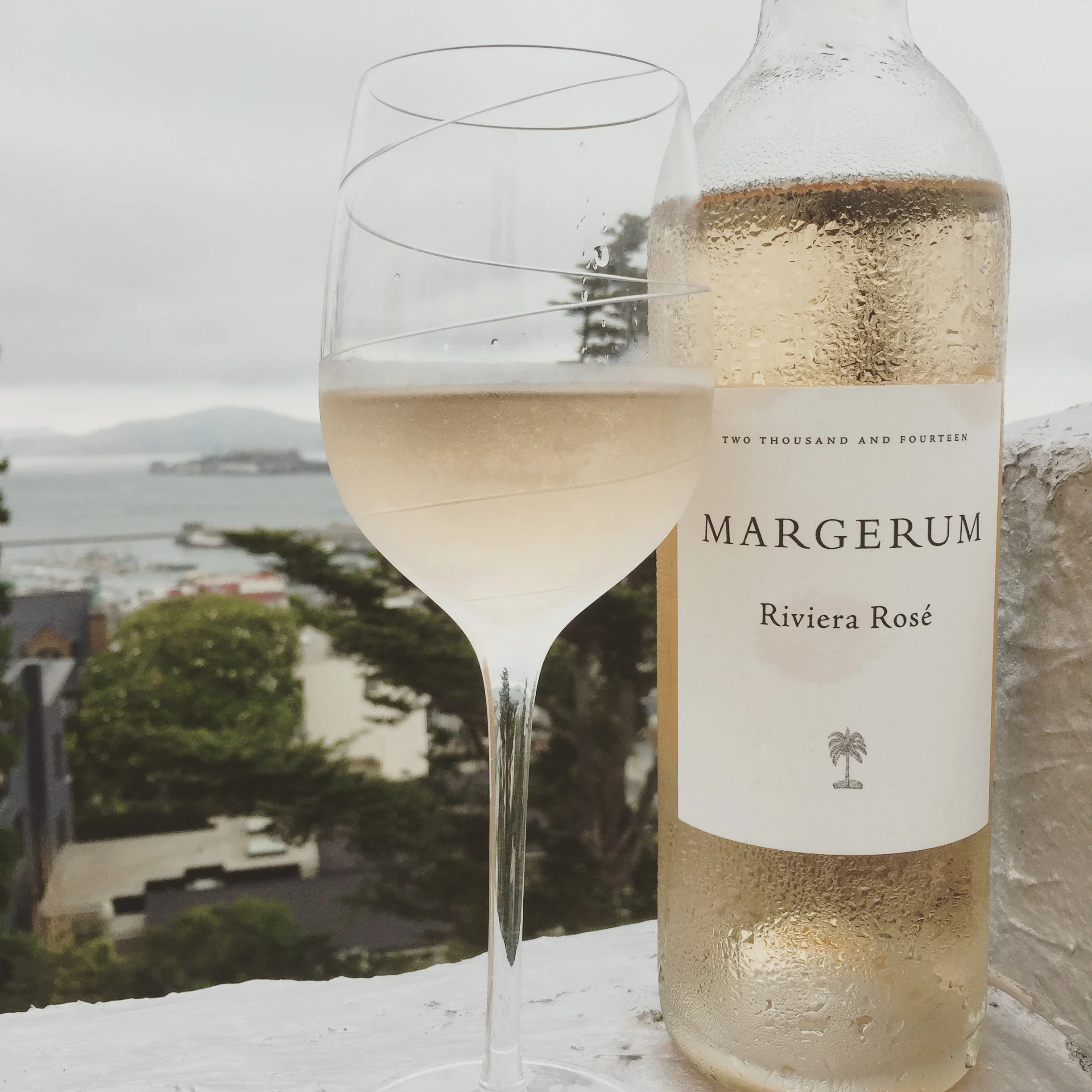 A glass of rosé and a view of Alcatraz from my rooftop - never gets old !