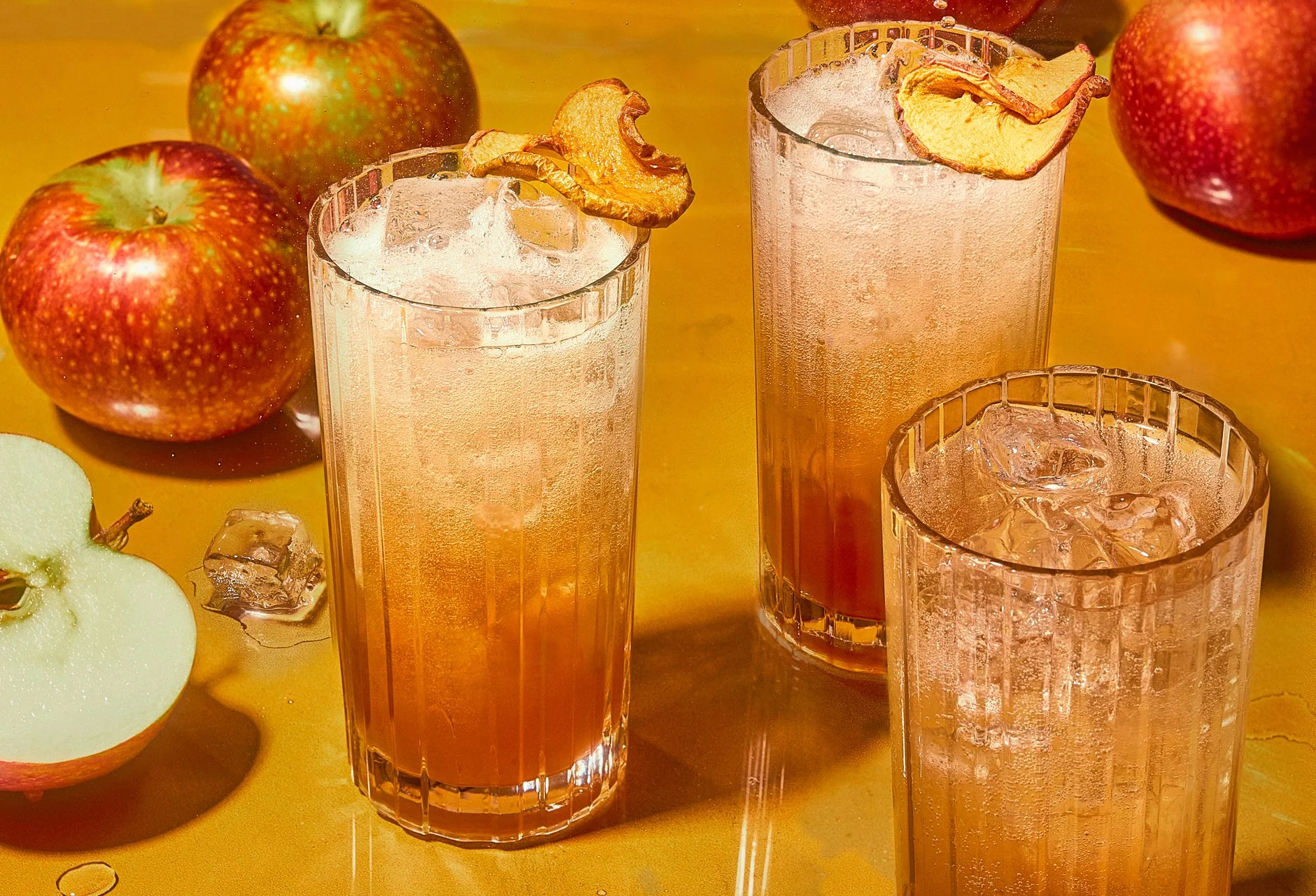 editorial beverage photo of a collection of apple cocktails / shot by commercial food photographer Ali Redmond