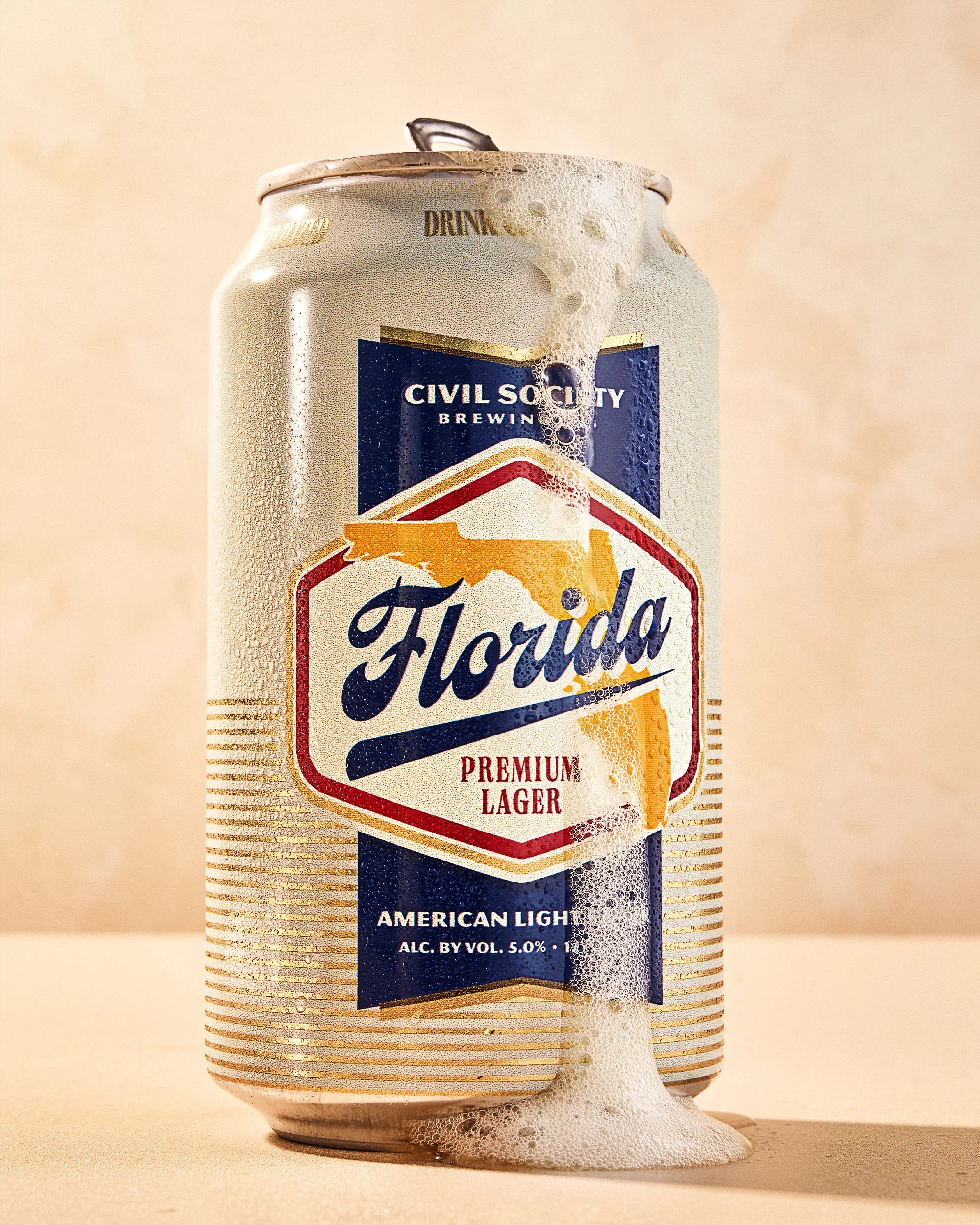 commercial food and beverage product photo hero shot can beer foam / shot by commercial brand food photographer Ali Redmond