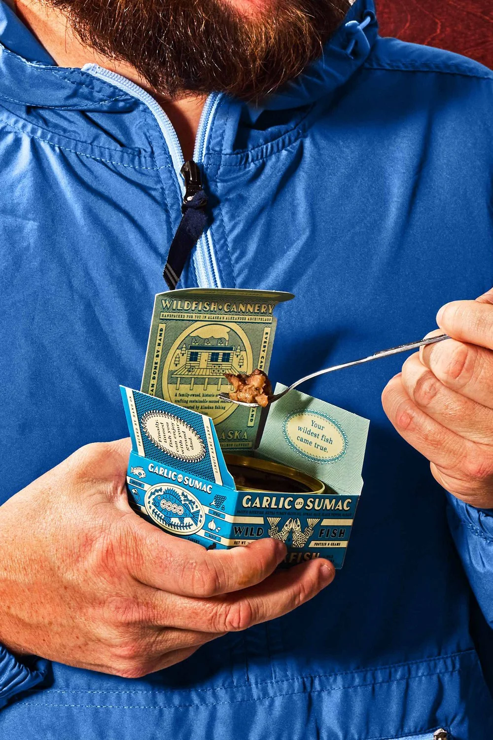 commercial food photo man holding tinned fish lifestyle / shot by commercial brand food photographer Ali Redmond