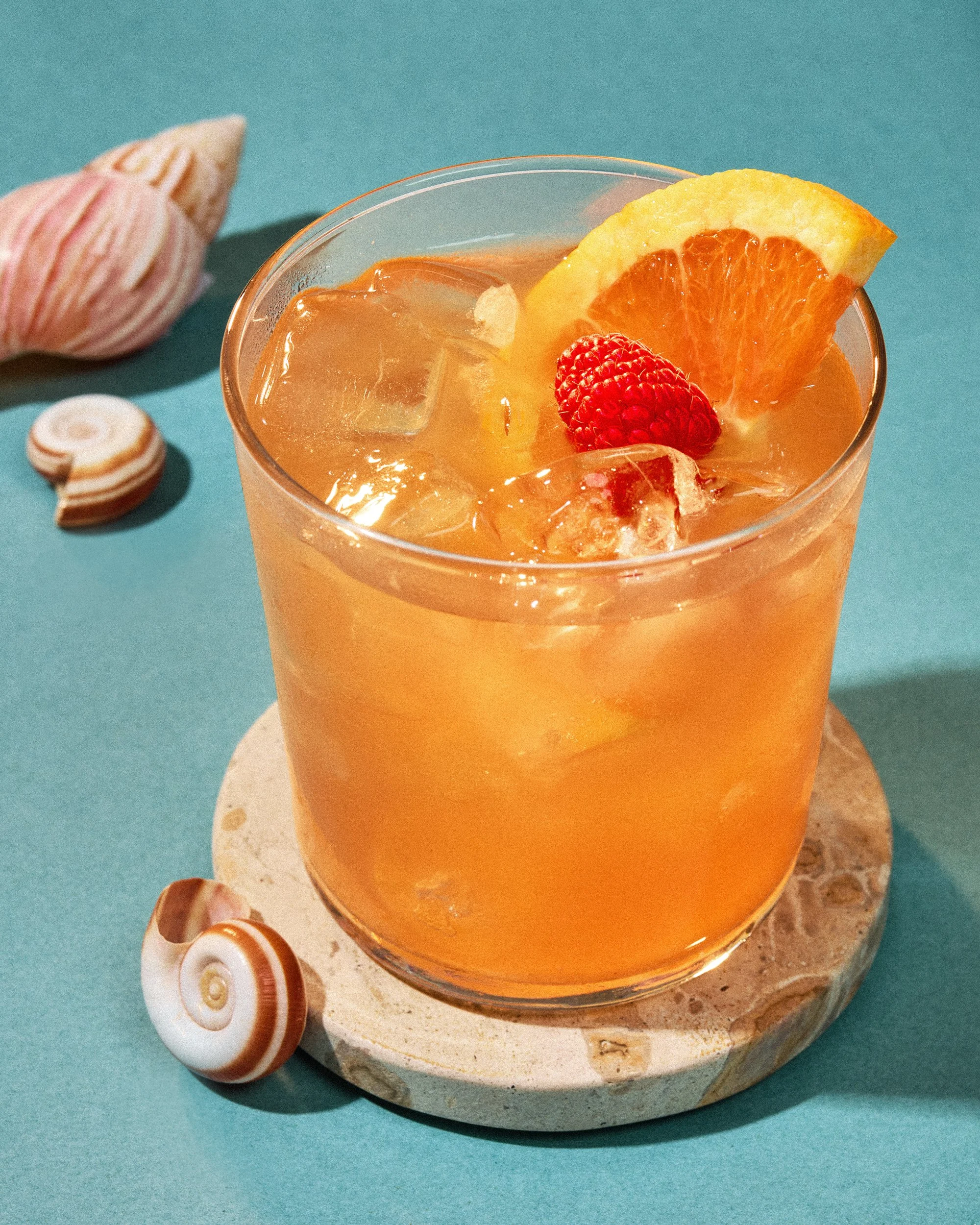 Commercial beverage photography of a  cocktail with shells by food and beverage photographer Ali Redmond