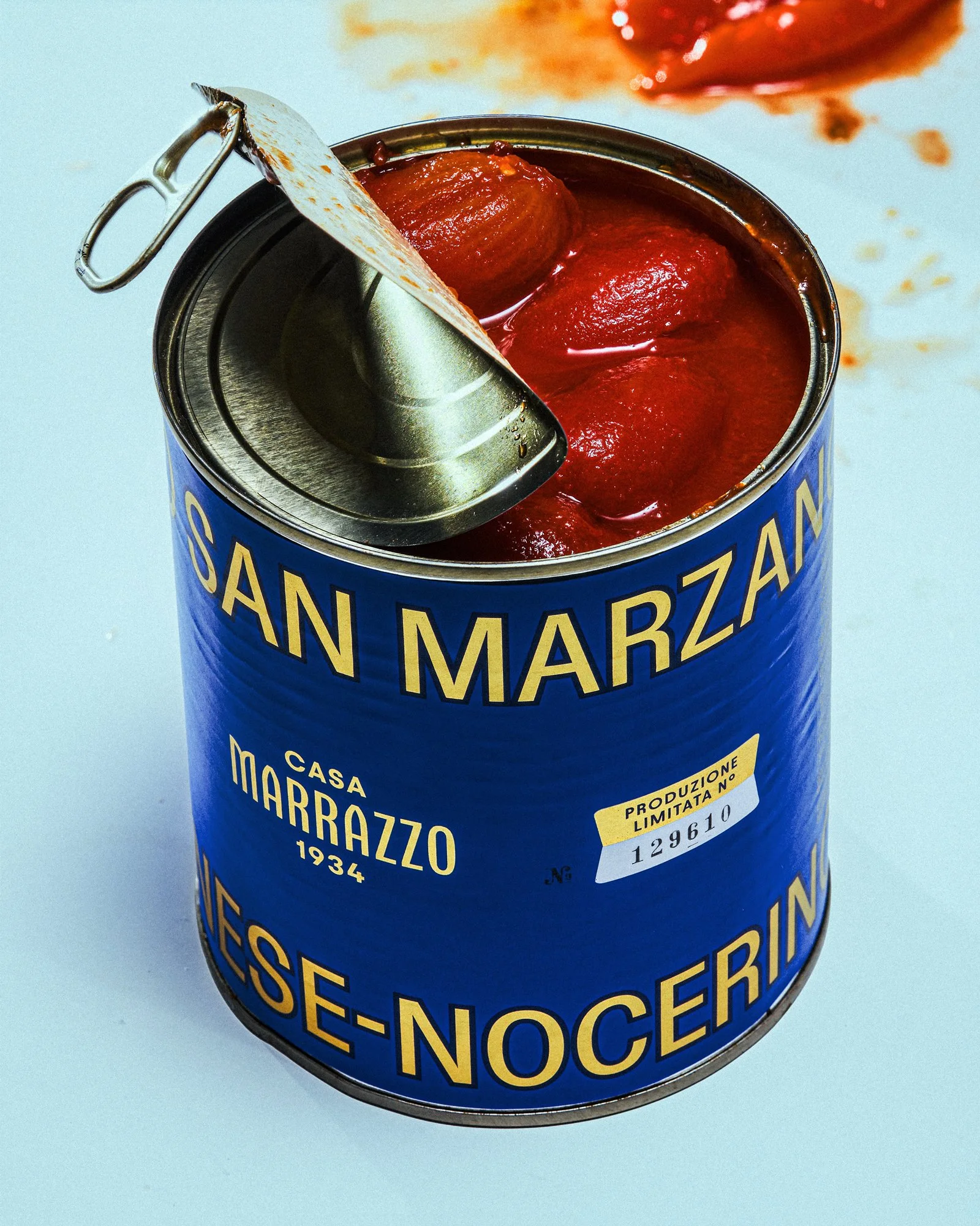 editorial food photo of a can of san marzano tomatoes  / shot by commercial food photographer Ali Redmond