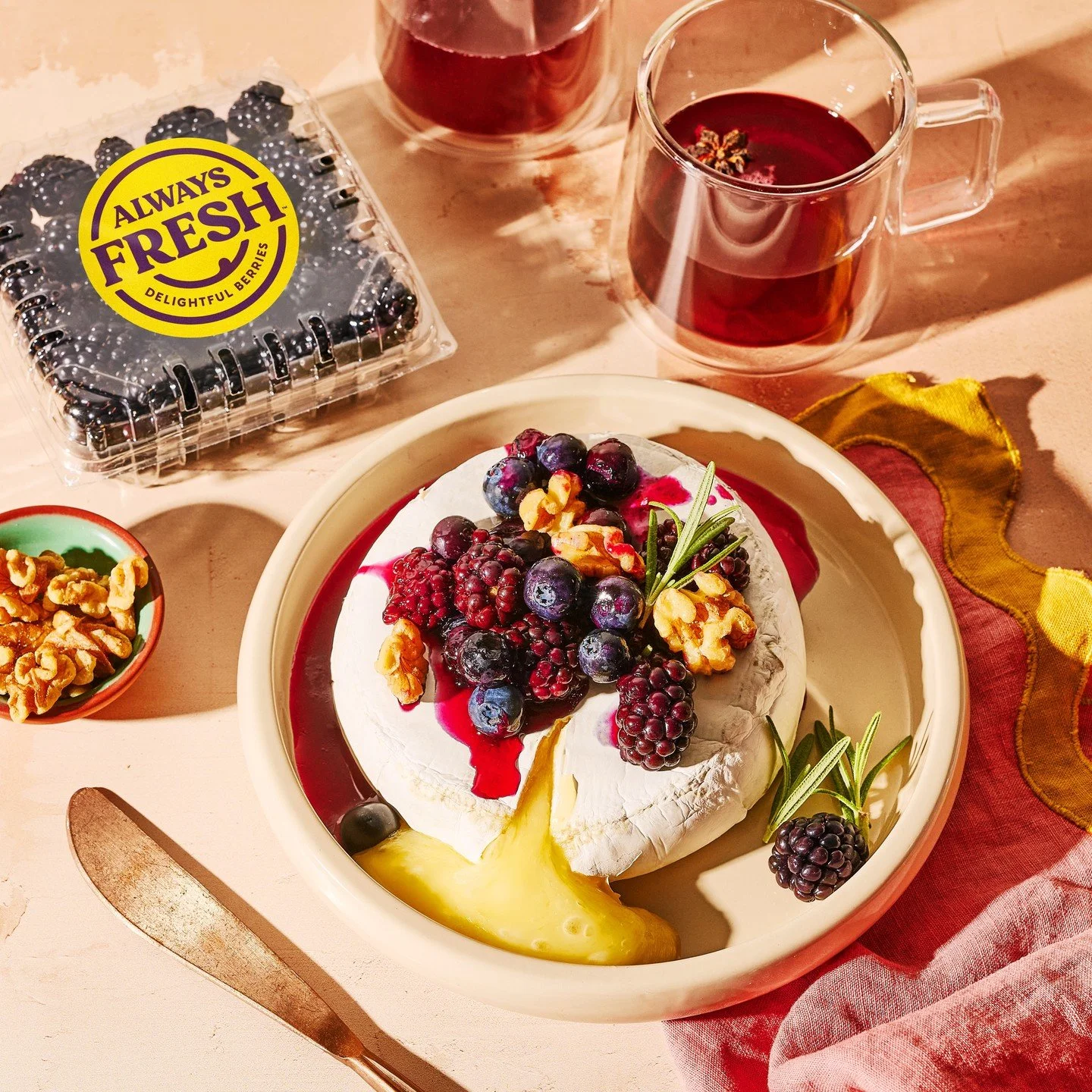 Commercial photography of brie cheese dish with blackberry product