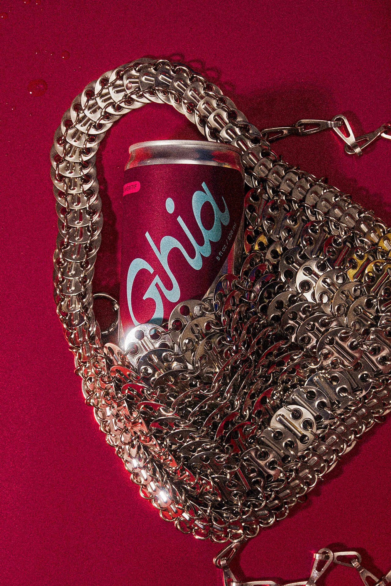 commercial beverage product photo can in chainmail purse / shot by commercial brand food photographer Ali Redmond