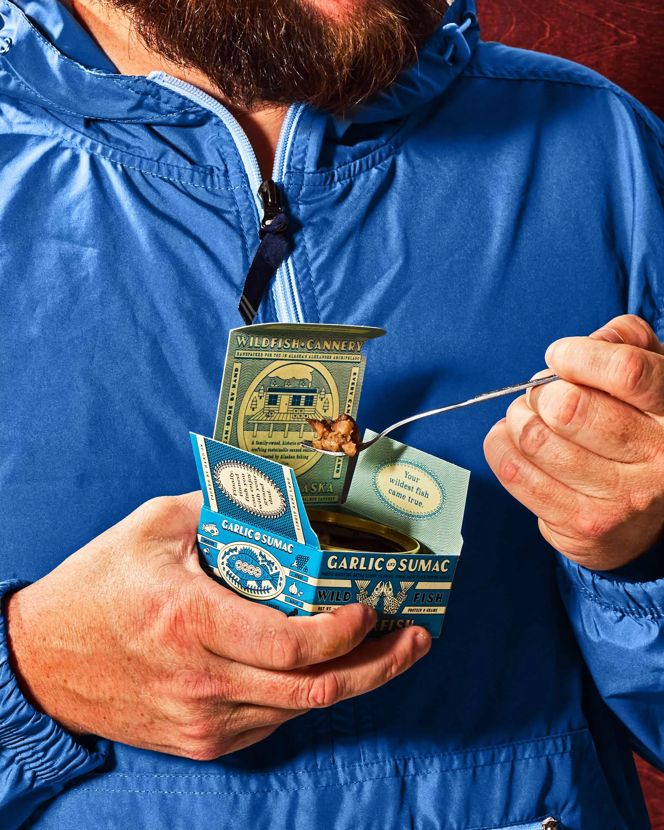 commercial food product photo man eating tinned fish product / shot by commercial brand food photographer Ali Redmond
