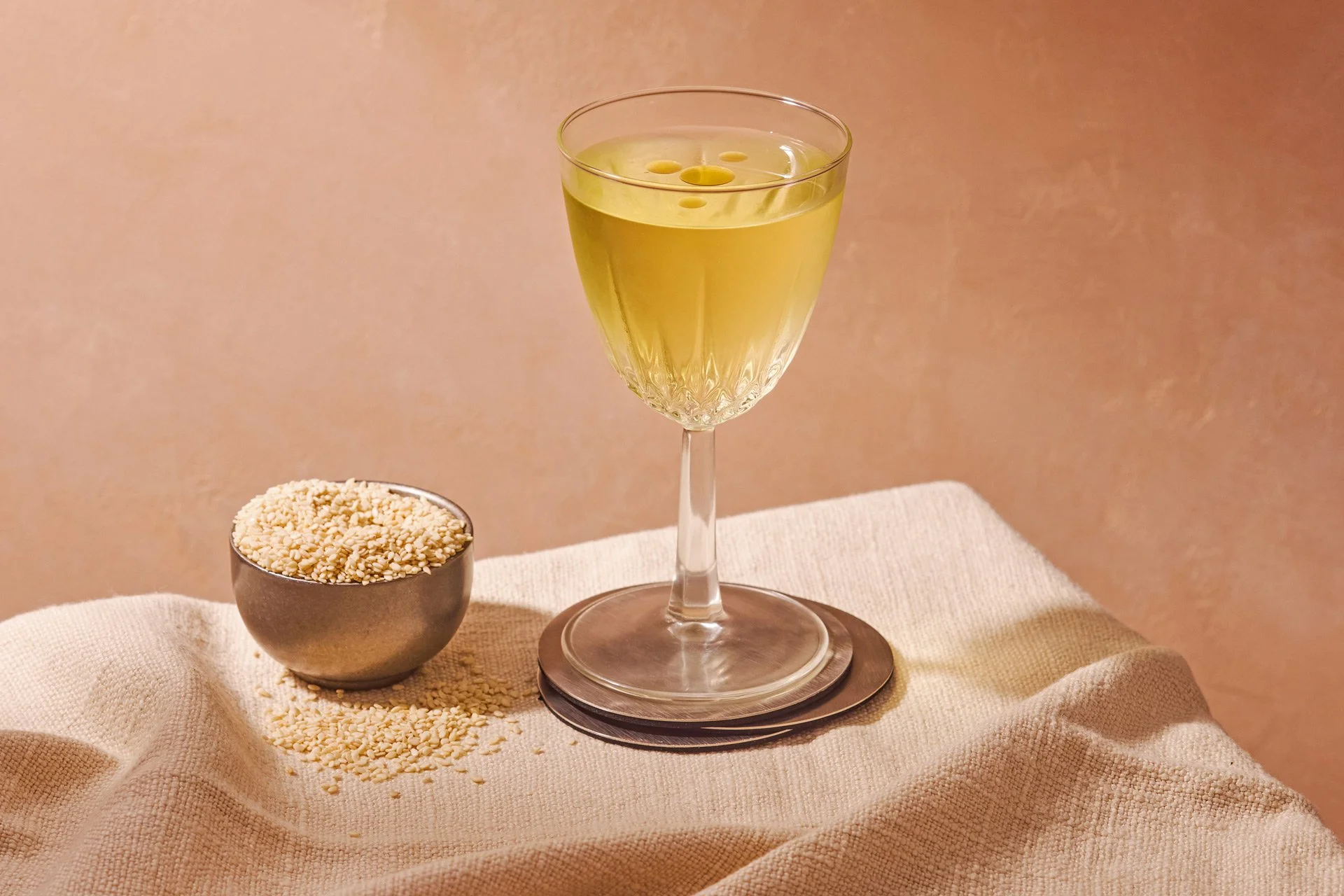 editorial beverage photo of a martini with sesame / shot by commercial food photographer Ali Redmond