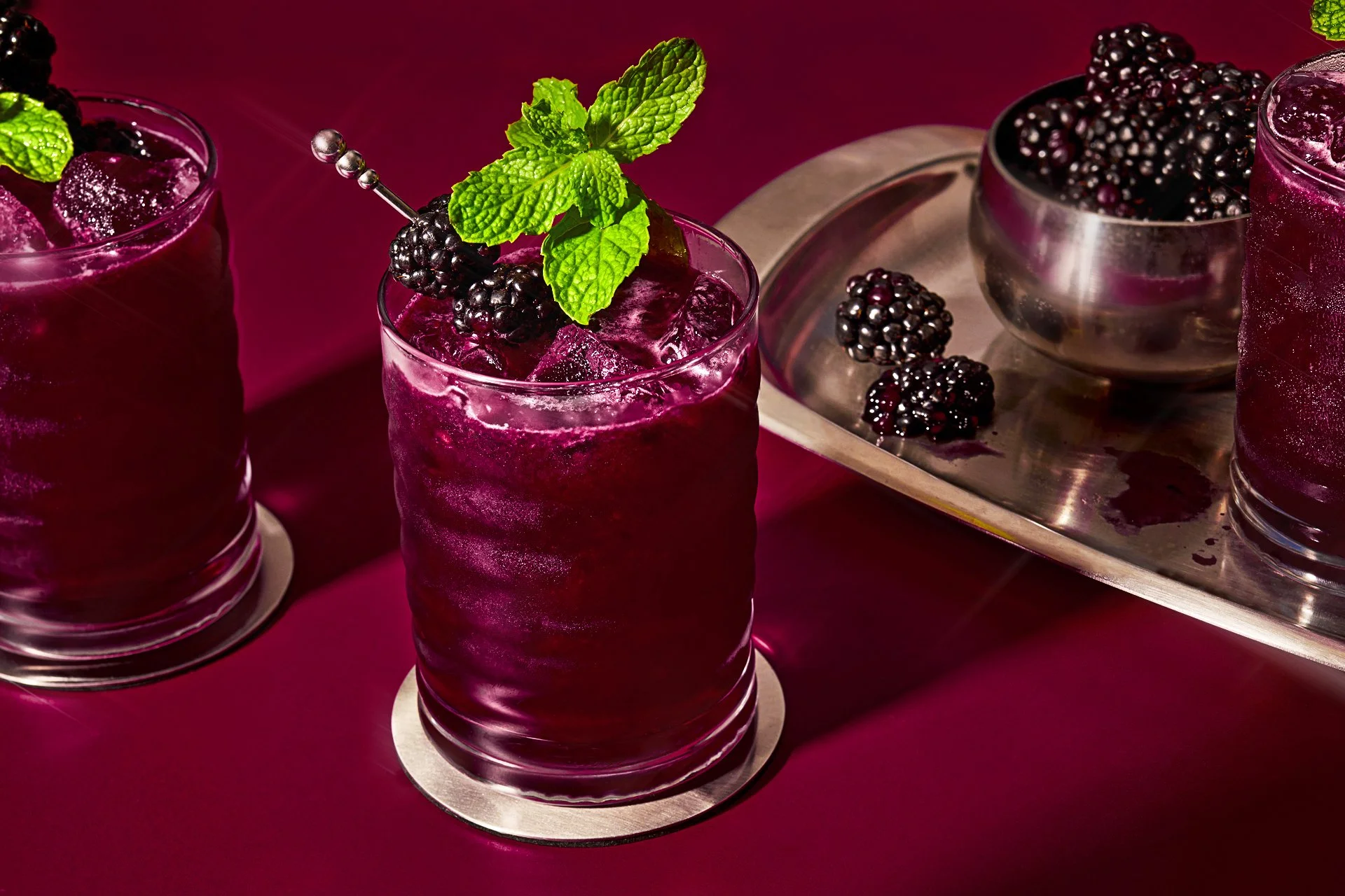 editorial beverage photo of a blackberry smash cocktail / shot by commercial food photographer Ali Redmond