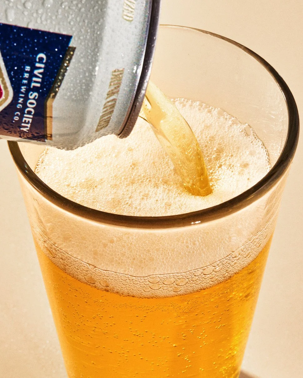 commercial product beverage photo of a beer being poured into a glass / shot by commercial food photographer Ali Redmond