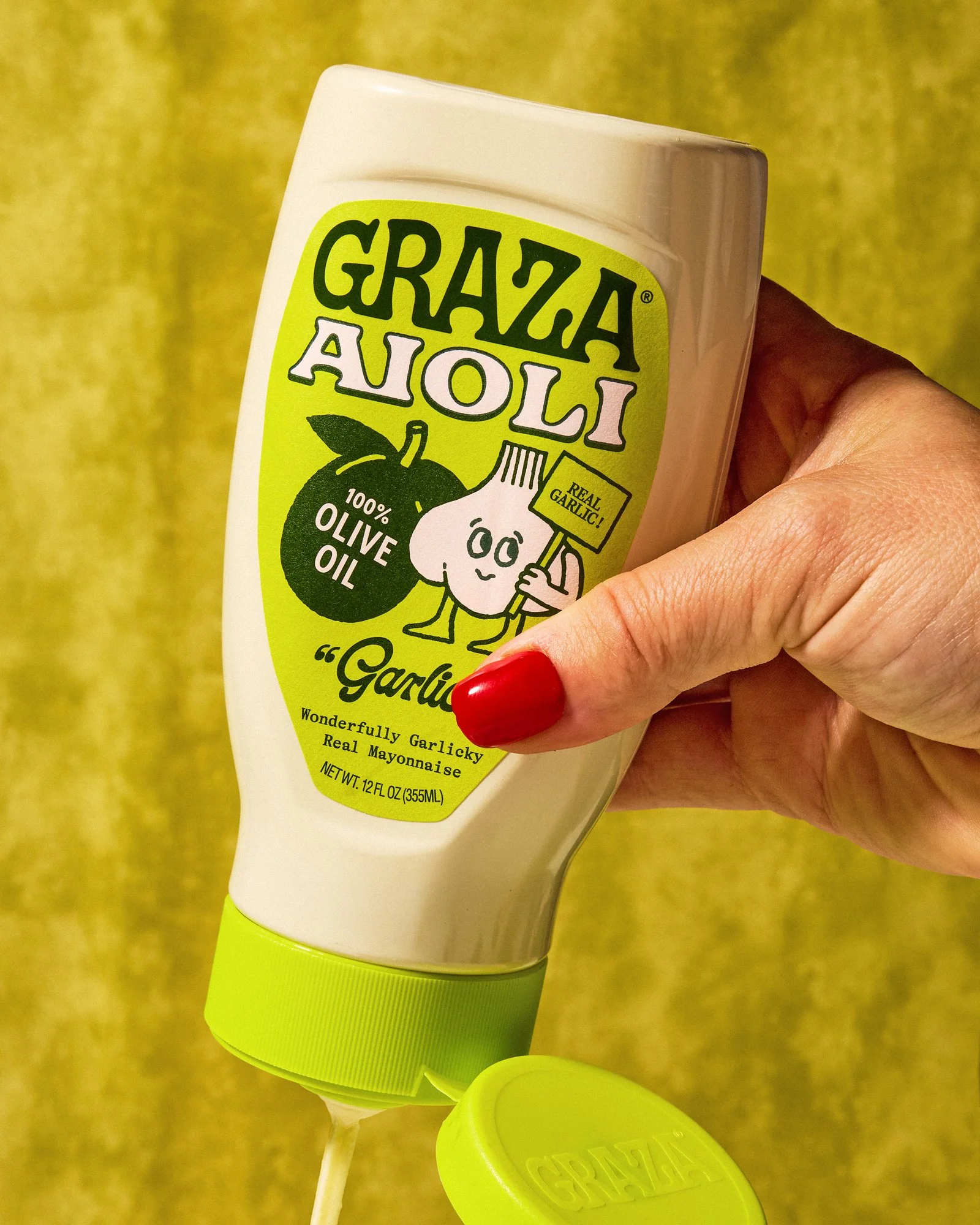 commercial food product photo hero shot hand holding condiment mayo bottle / shot by commercial brand food photographer Ali Redmond