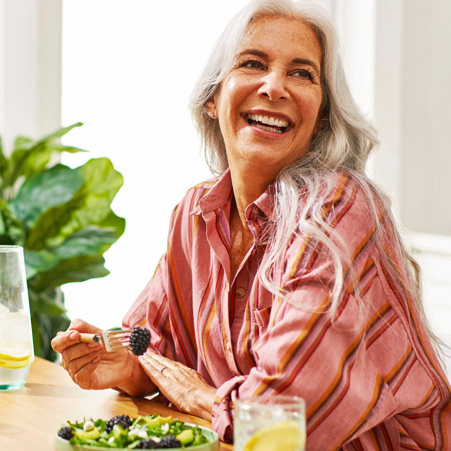 Commercial photography of a woman eating a salad