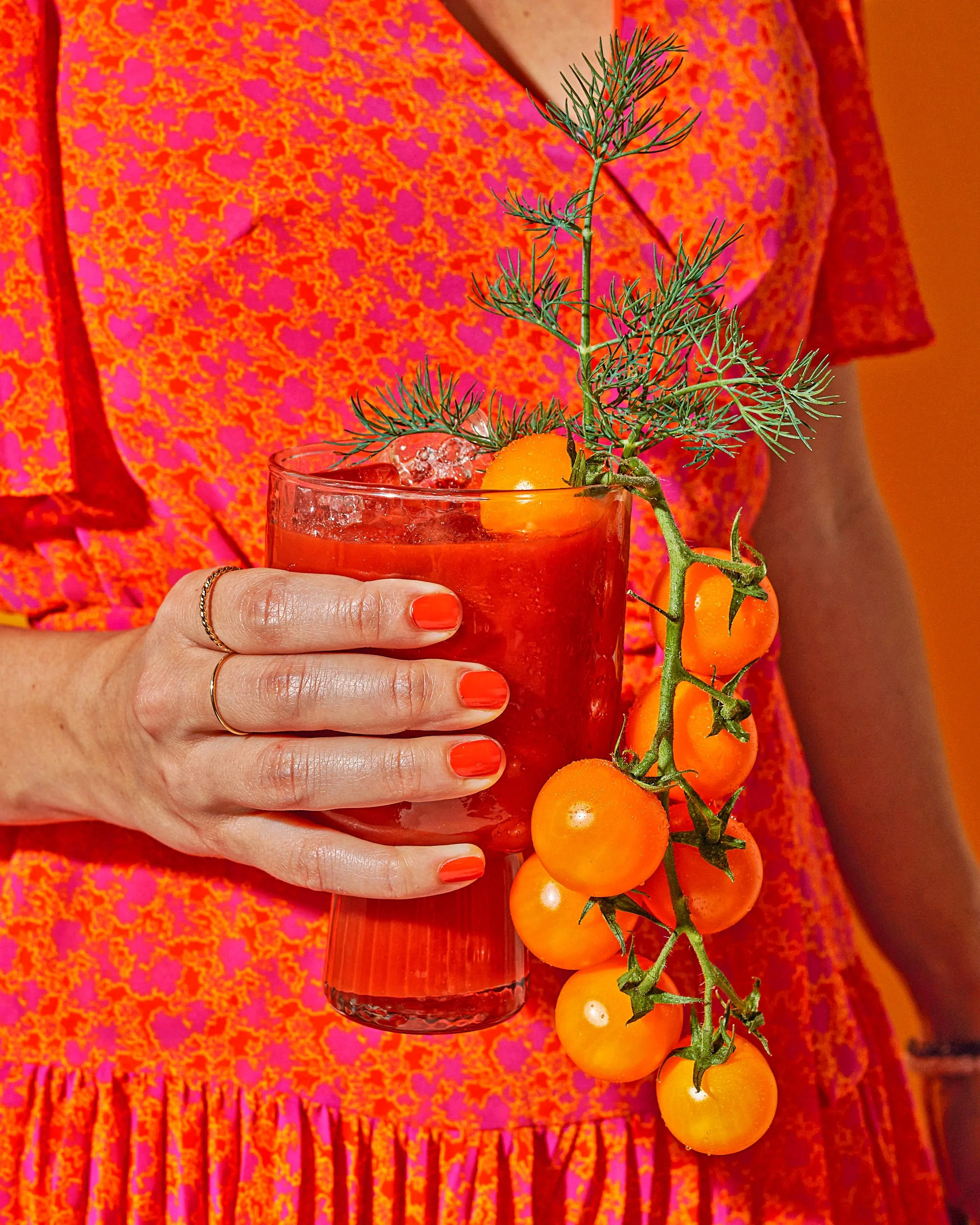 editorial food photo of a woman holding a bloody mary drink / shot by commercial food photographer Ali Redmond