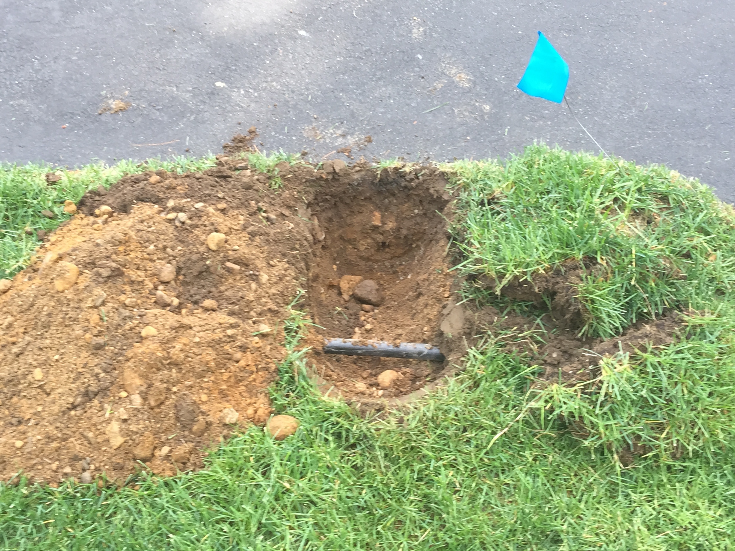 Each sprinkler head requires a hole to be dug to hook up equipment to water source. Special care is paid while digging, separating existing grass and underlying dirt to ensure efficient installation and more importantly, minimal damage.