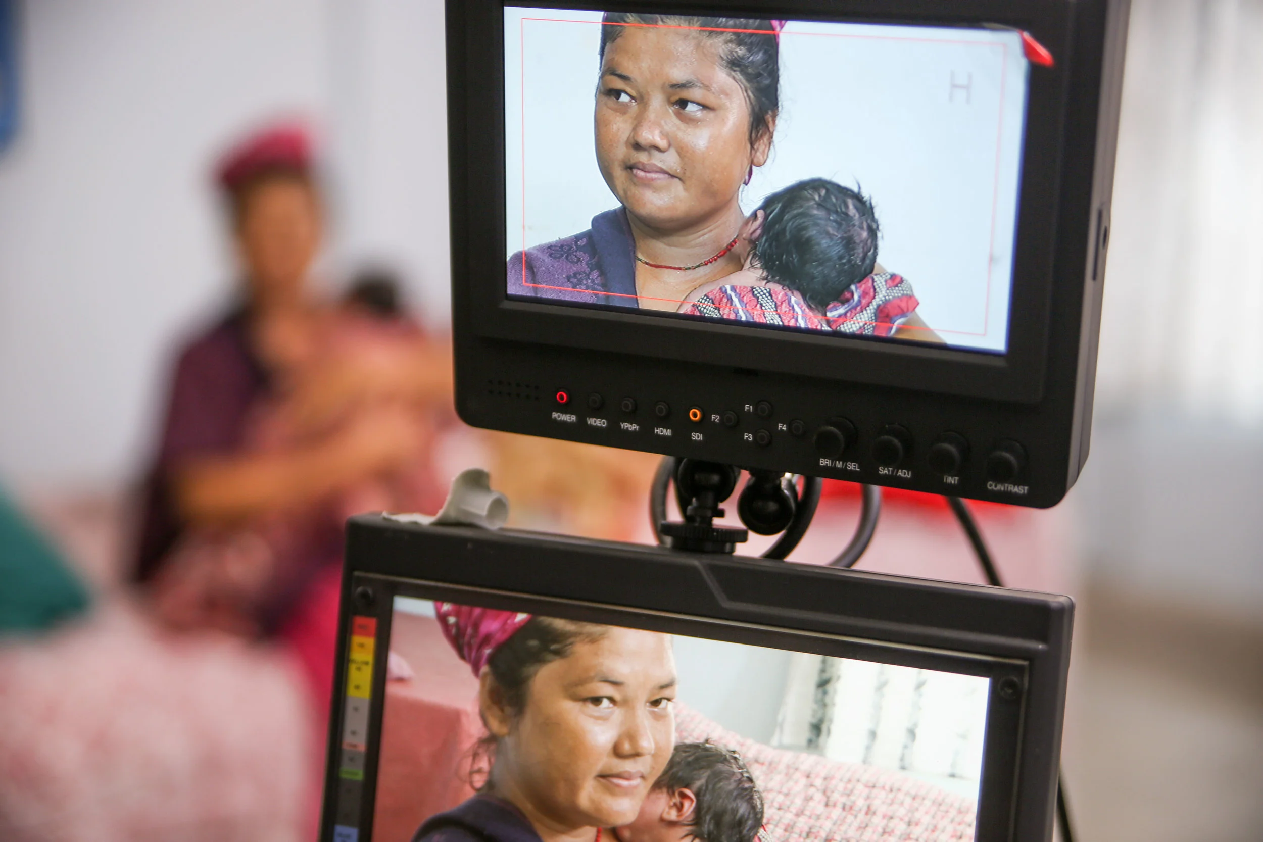 viewing-the-monitors,-filming-breastfeeding-in-Nepal-CC.jpg