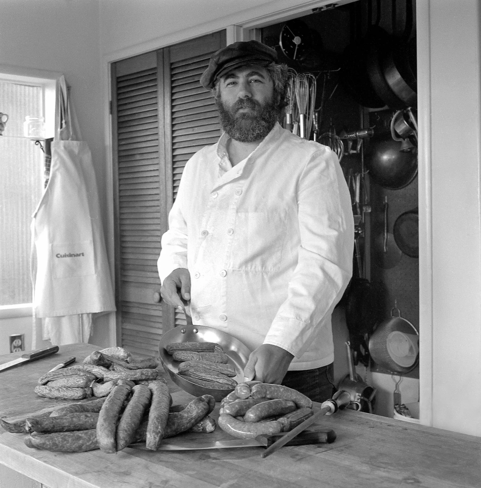 Bruce Aidells in kitchen making sausage 