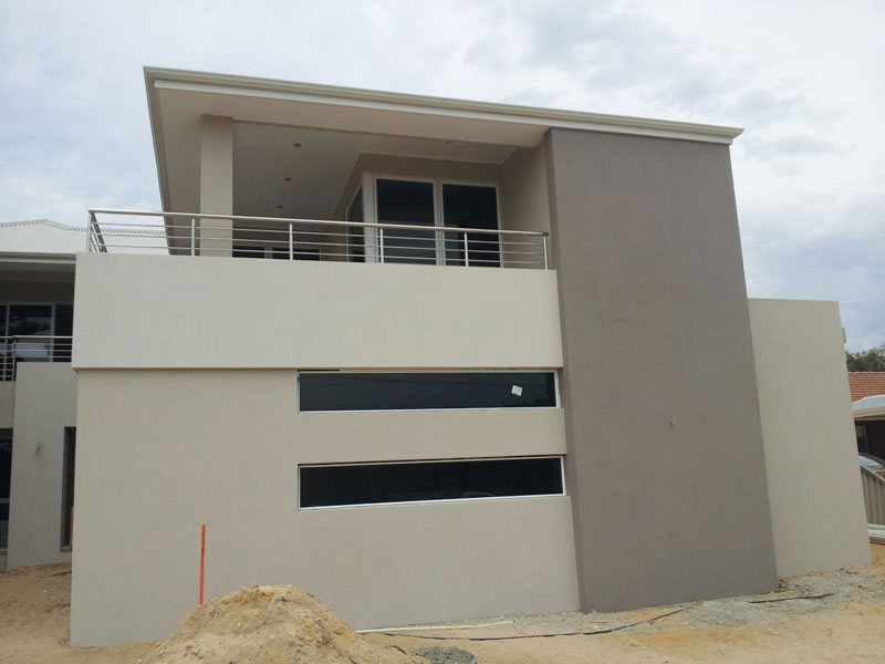 Acrylic render with corbelling