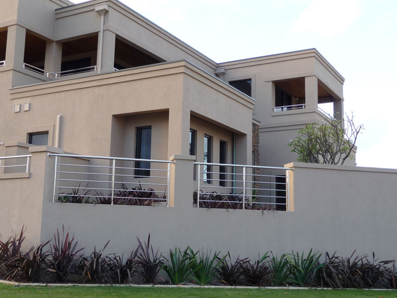 Acrylic render with corbelling