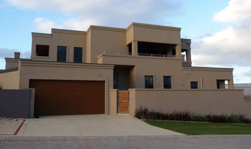 Acrylic render with corbelling