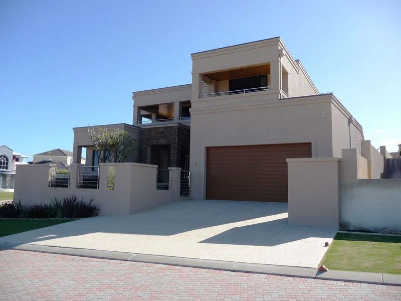 Acrylic render with corbelling
