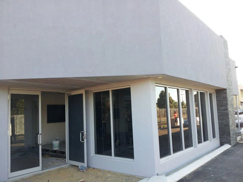 Renovated factory with blueboard and acrylic render