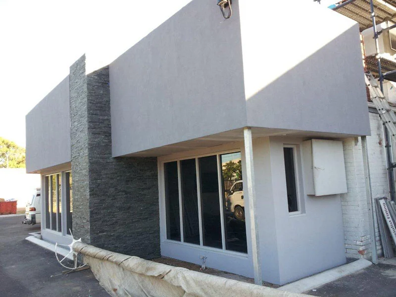 Renovated factory with blueboard and acrylic render