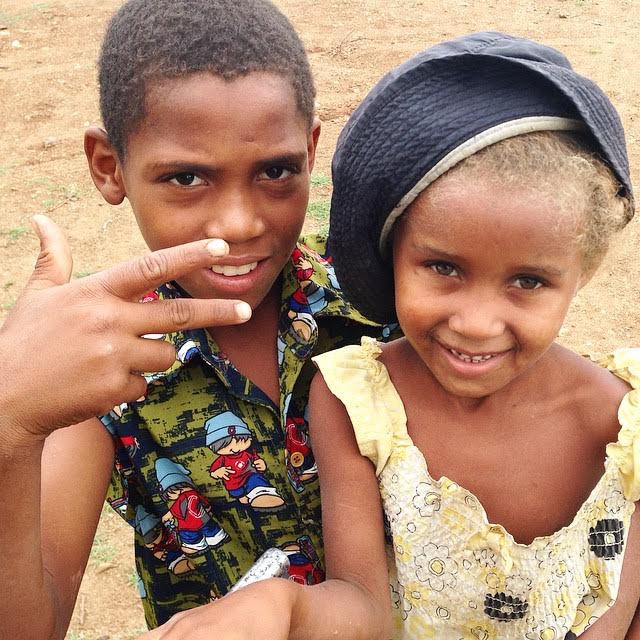 These two took a break from pumping water from their local well to pose for a picture