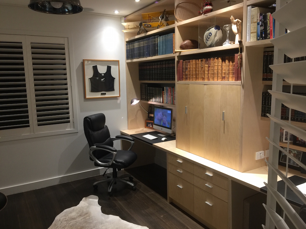 Paul's library was designed with all the features to display his mementos collected over the years