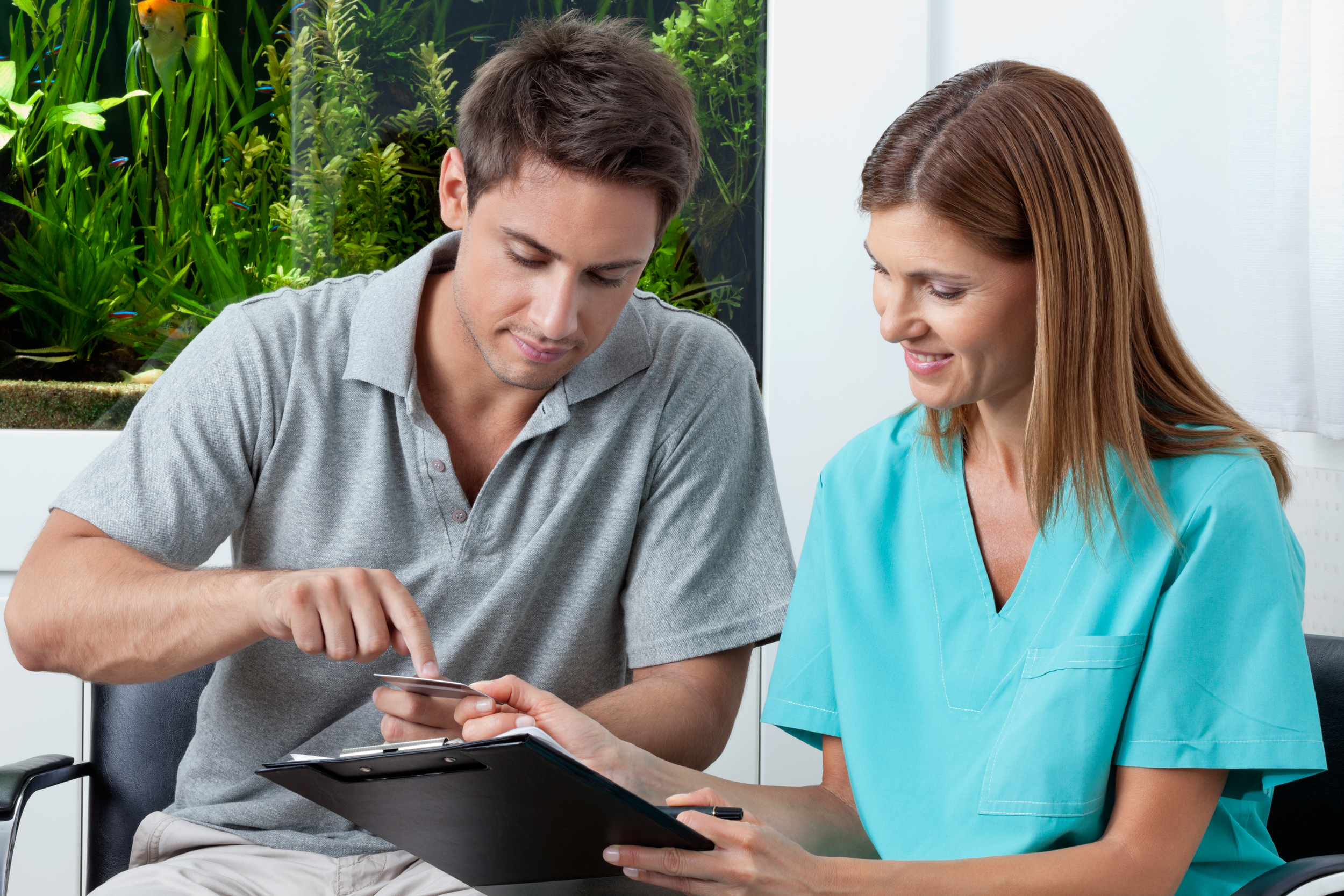 bigstock-Young-man-paying-bill-through--38551873.jpg