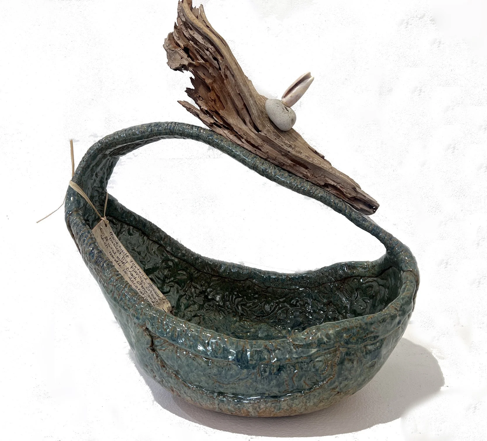 Textured green basket with driftwood, olive shell and mother stone 15x18x11 $450.jpeg