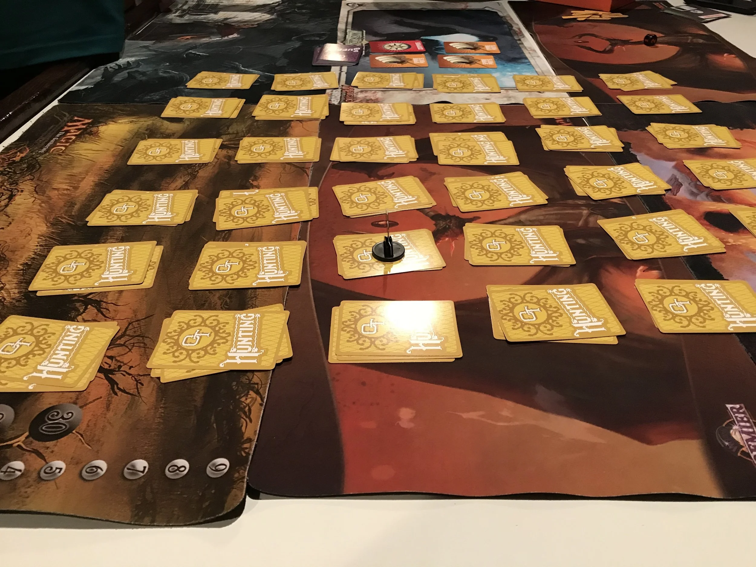 The board has cards lined up in piles forming a 6x6 grid.