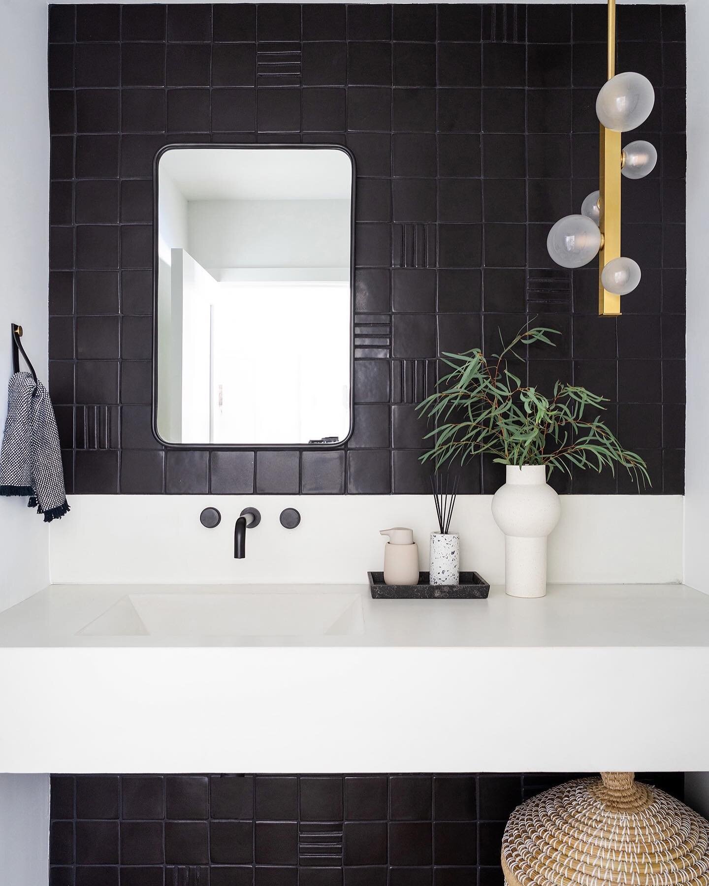 Powder bath goodness with its custom layout in matte black tile + concrete integrated sink.  And the prettiest pendant - she&rsquo;s a moment. ▪️▪️▪️▪️

Design: [FIXE]
Photo: @lanedittoe
#FIXExNautilus
&bull;
&bull;
&bull;
&bull;
&bull;
#FIXEdesignho