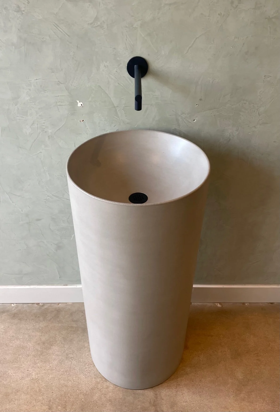 light grey handmade concrete pedestal sink.jpg
