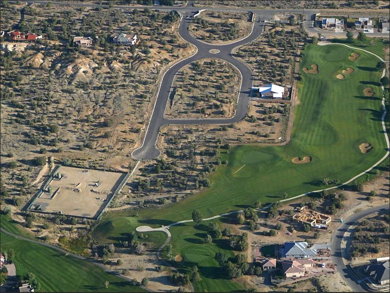 lower left corner is a well pad for oil and gas drilling. note close proximity to homes in the Four corners area of new mexico. Photo Ecoflight
