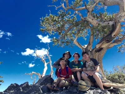 Mo and family tree and sky.jpg