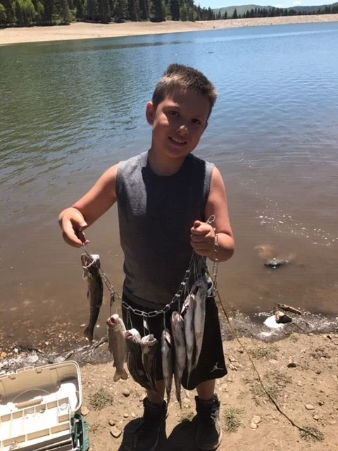 Utah State Rep. Wheatley’s grandson, Isaiah (Mark’s son), on his first day of fishing.