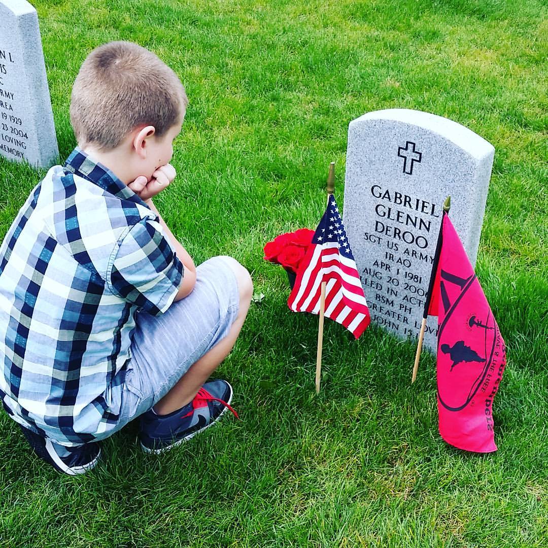 Our grandson Gabriel at his father's gravesite on Memorial Day.