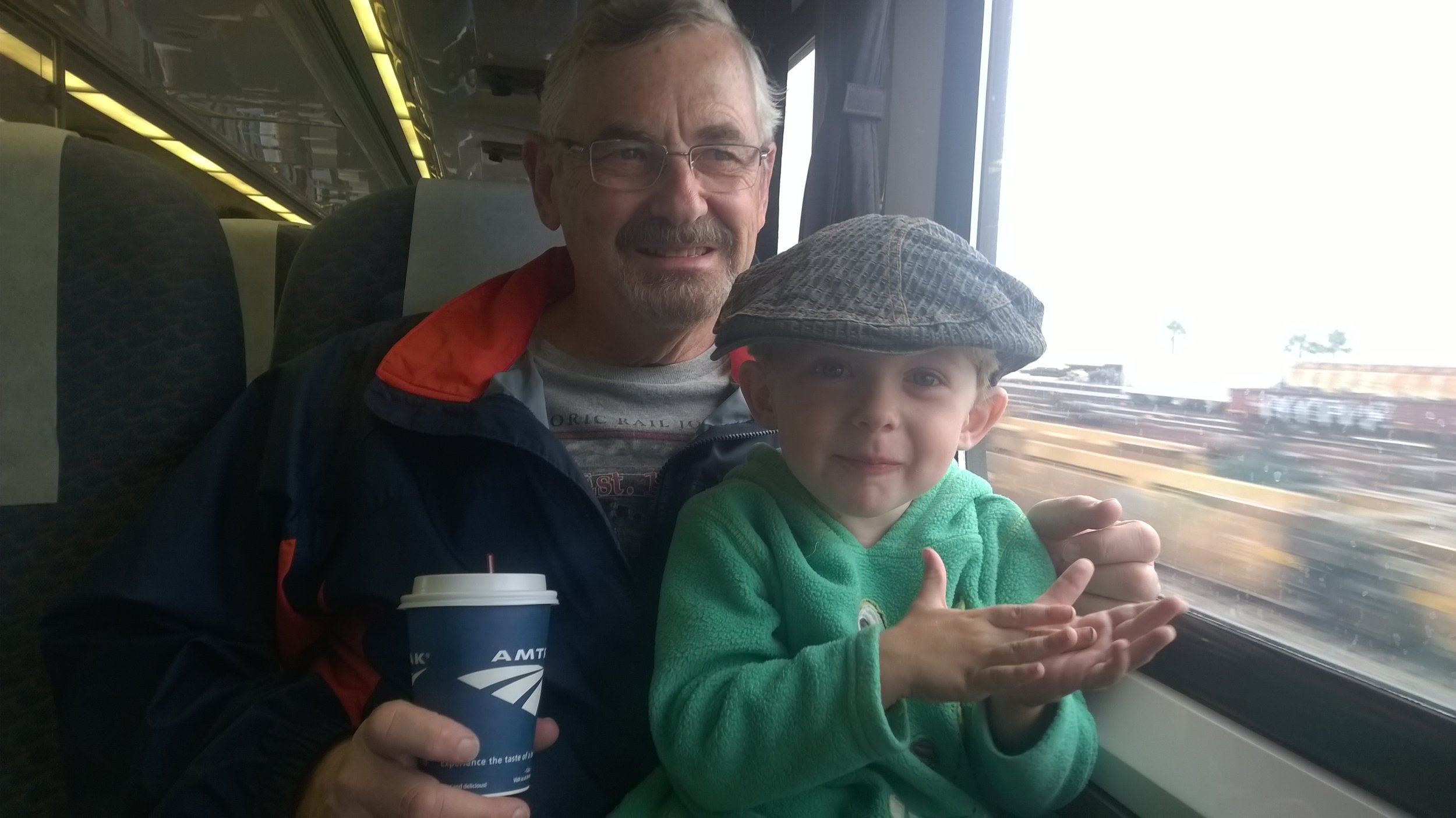 Grandpa Mark and Noah loving the train ride.
