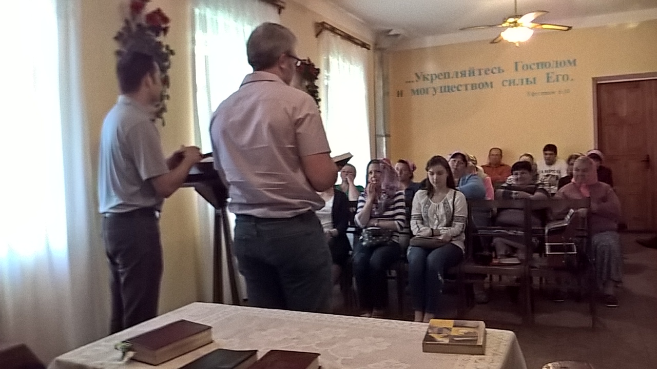 Chris preaches the Word as Caleb translates.