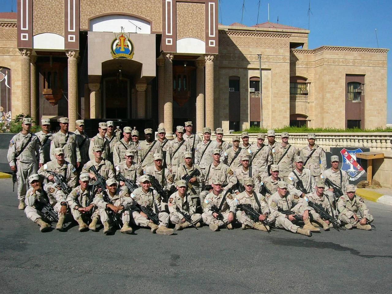 Sgt. De Roo with our US troops in front of one of Saddam Hussein's palaces.
