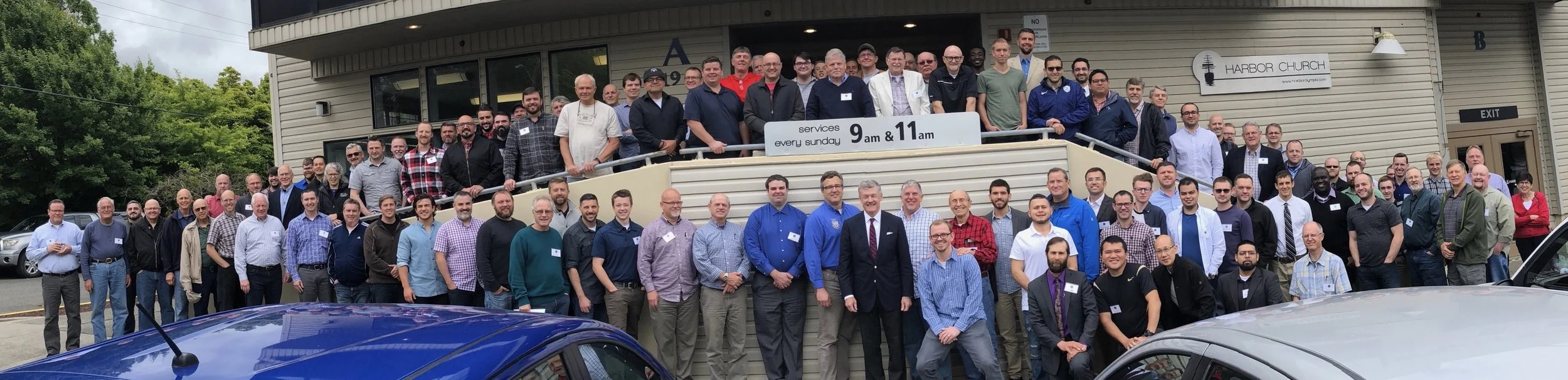 Our preaching conference group meets outside during a break. Can you fine our guys in the picture?