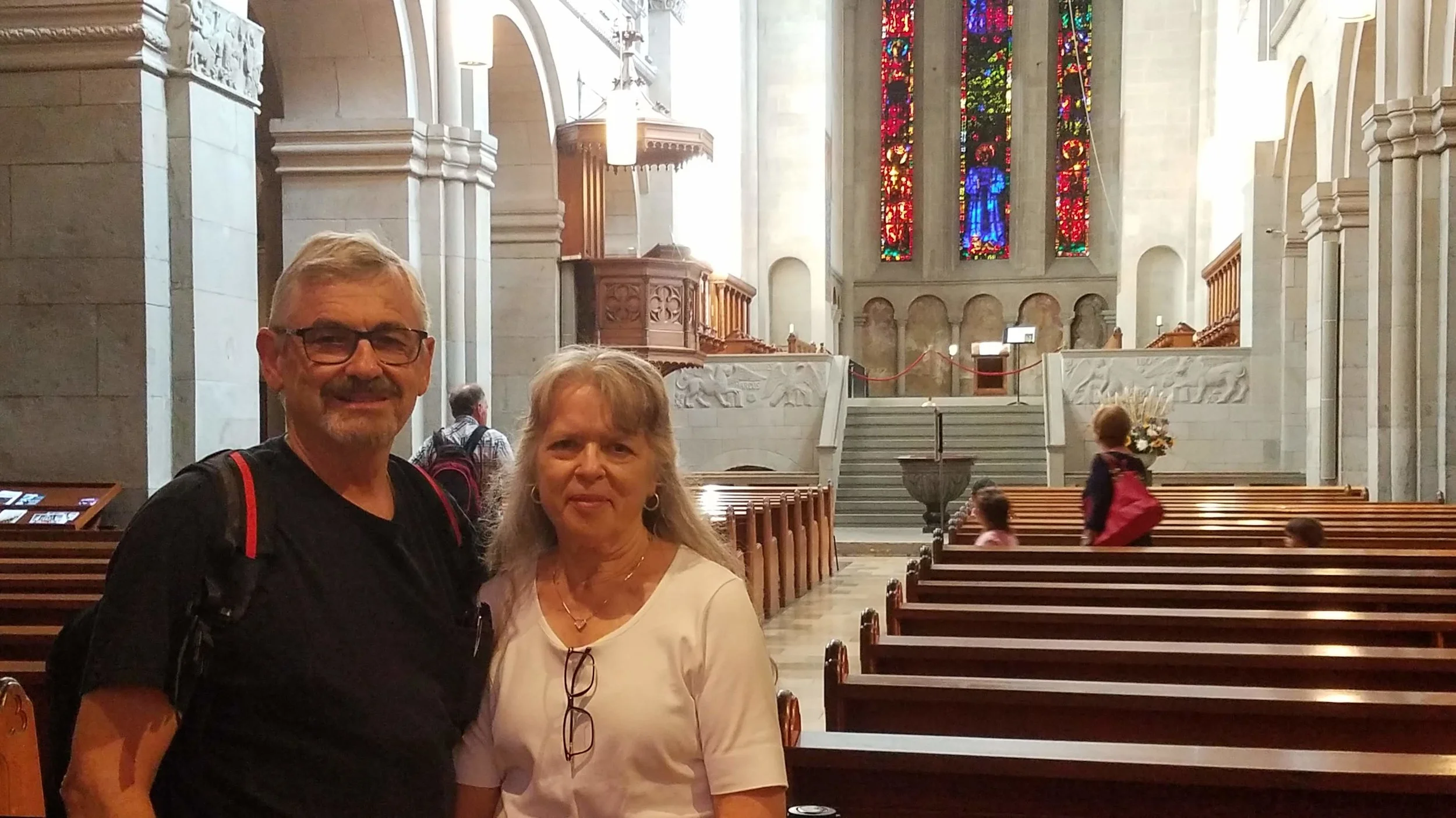 The inside as it is today with pews and the side pulpit that replaced the central wood one Zwingli used.